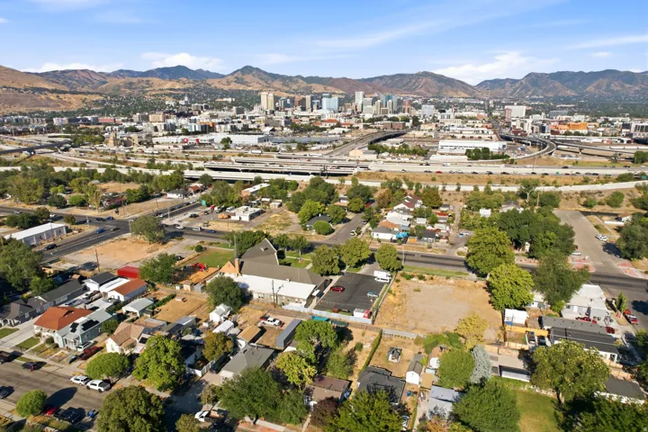 Aerial perspective showcasing a developed urban landscape with residential properties and commercial structures