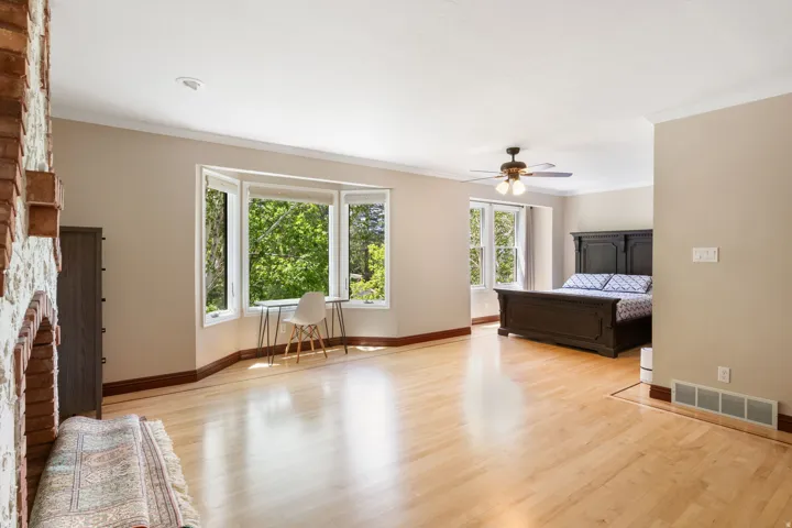 Hardwood flooring extends throughout this expansive space