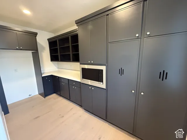 Pantry featuring Extensive built-in cabinetry with a dedicated microwave niche
