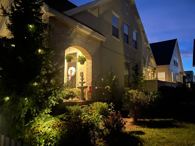 Stucco and brick facade with an arched entry