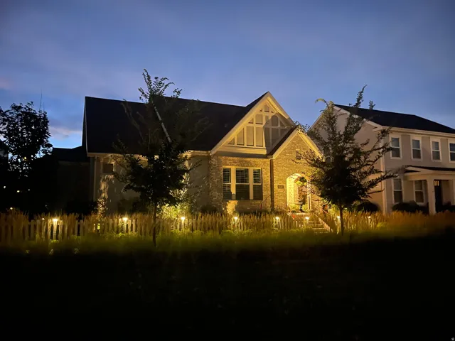 Stone and siding exterior with a prominent gabled roofline