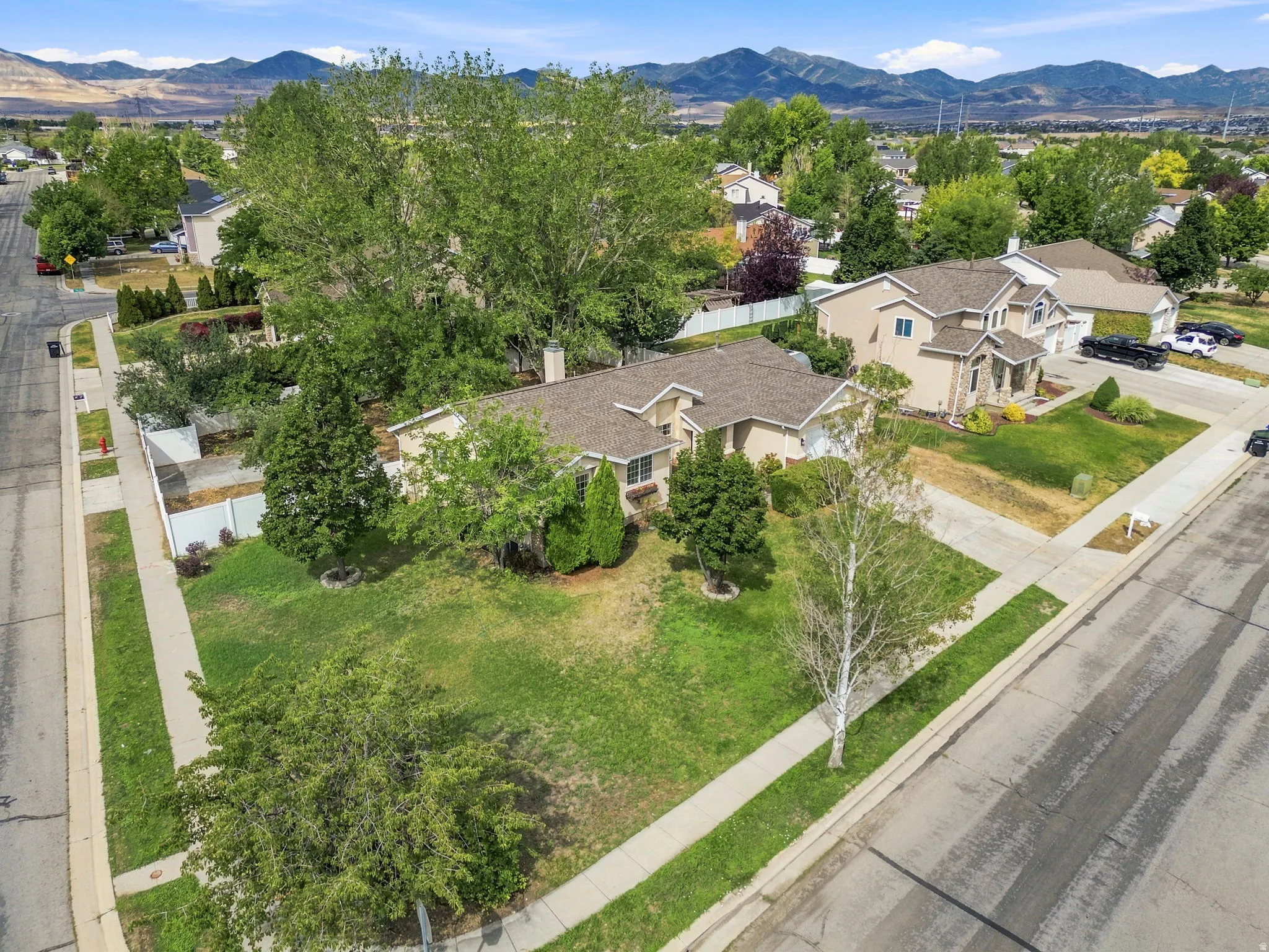 Aerial perspective showcasing residential properties with mountain backdrops