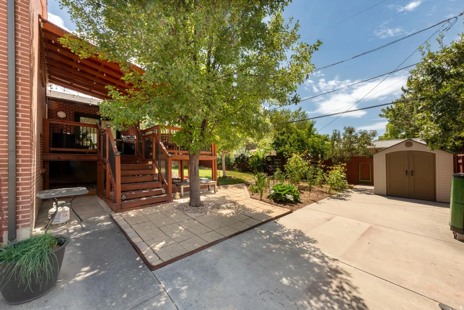 Deck, patio, RV pad, vegetable garden, and shed