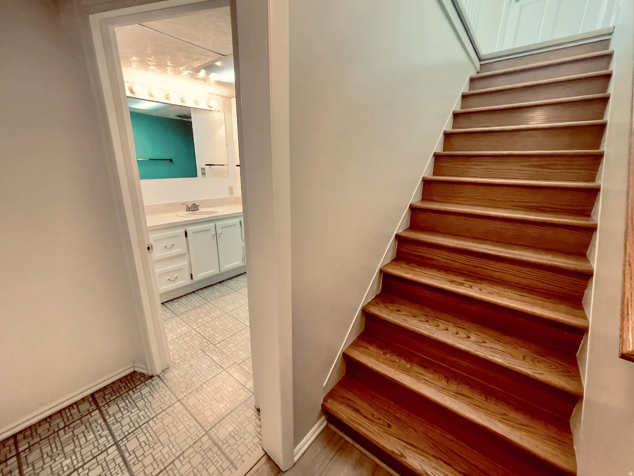 Wood-finish staircase with white risers