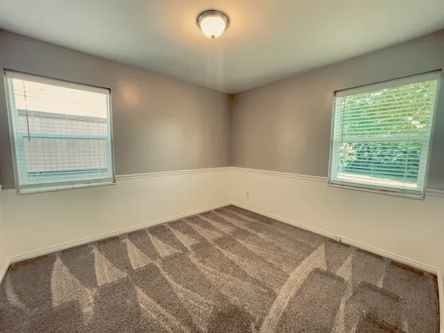 Neutral-toned interior with patterned carpet flooring