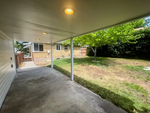 Covered concrete patio with recessed lighting
