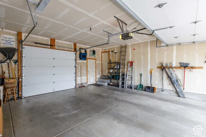 Concrete flooring throughout this garage space