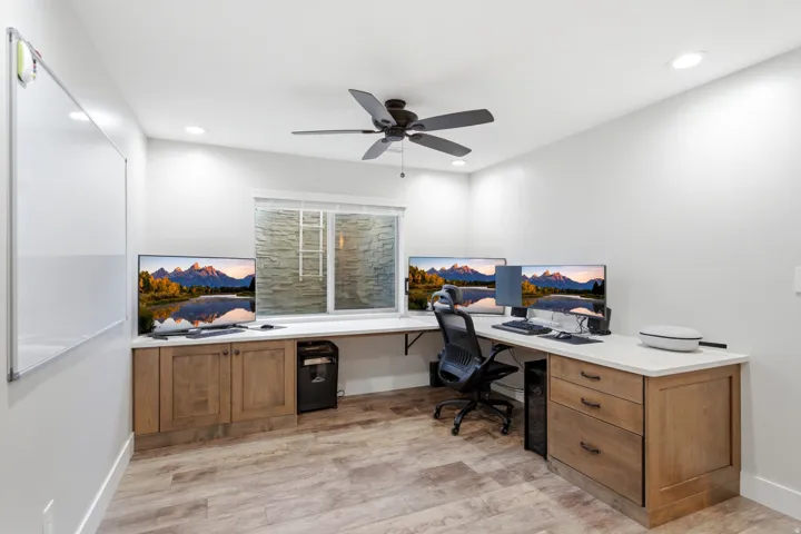Wood-finish flooring, recessed lighting, and a ceiling fan