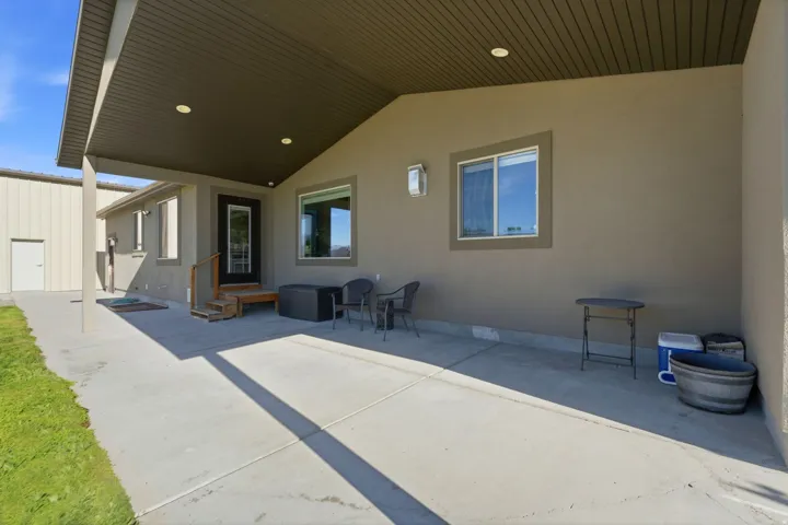 Covered concrete patio with recessed lighting