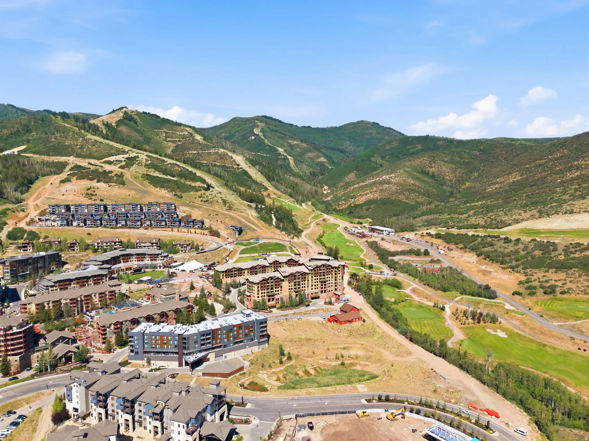 Aerial perspective showcasing a mountain community with diverse architectural styles