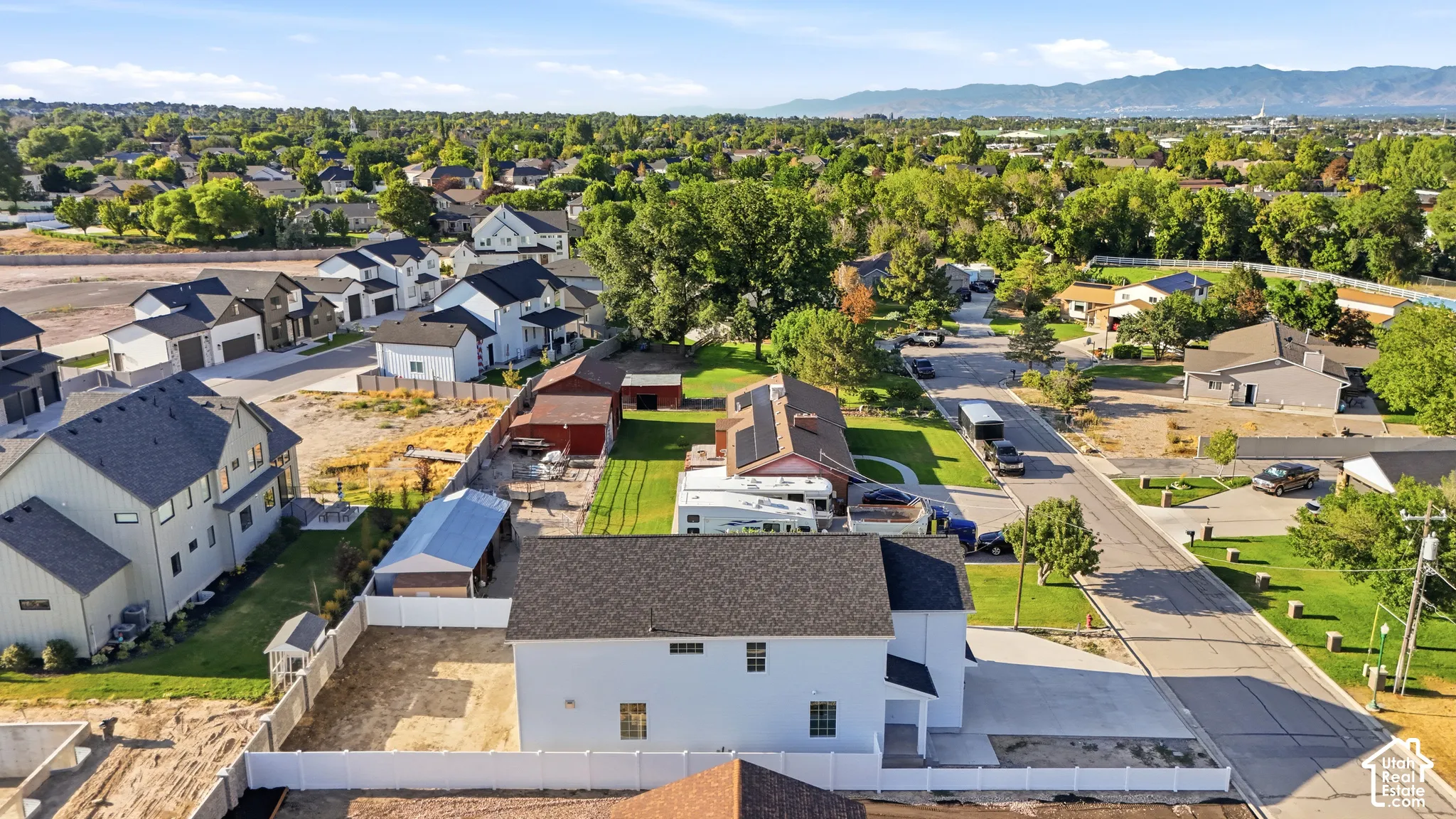 Aerial perspective showcasing a residential neighborhood with a mix of new construction and established homes