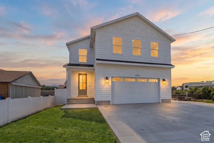 Modern two-story residence featuring white siding and coordinating trim *grass ai generated