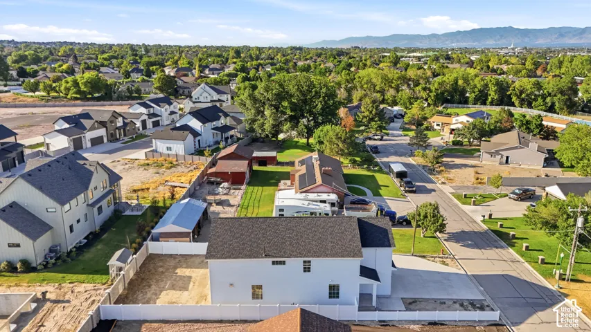 Aerial perspective showcasing a residential neighborhood with a mix of new construction and established homes
