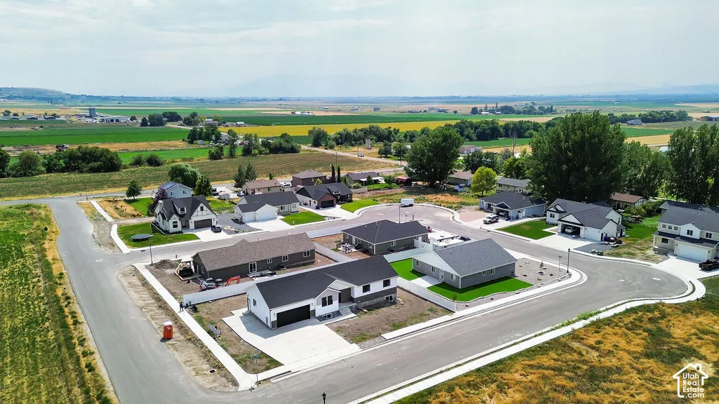 Contemporary residential development featuring cul-de-sac streets, new construction homes, and manicured lawns