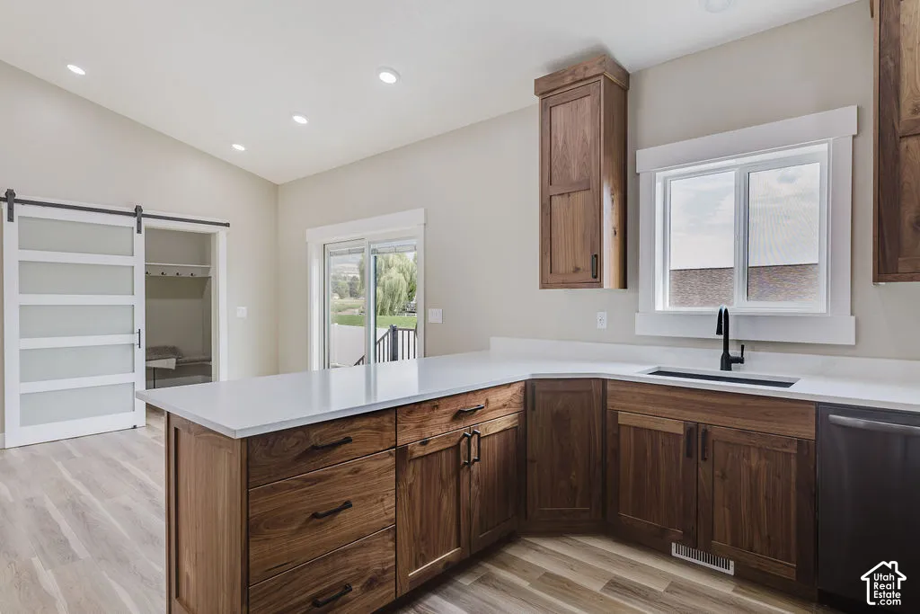 Kitchen featuring wood-finish flooring, recessed lighting, and a white countertop