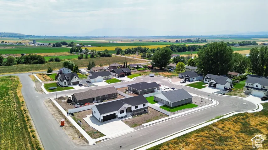 Contemporary residential development featuring cul-de-sac streets, new construction homes, and manicured lawns