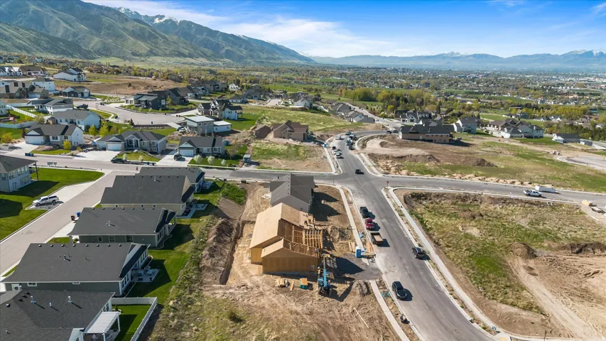 Newly framed construction offering a modern residential setting with mountain scenery