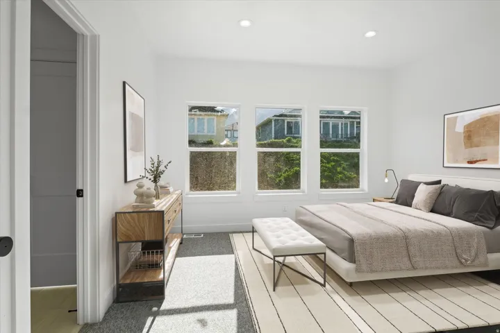 Ai Generated staging. Bedroom featuring three large windows, recessed ceiling lighting, a neutral color palette, and two distinct flooring types