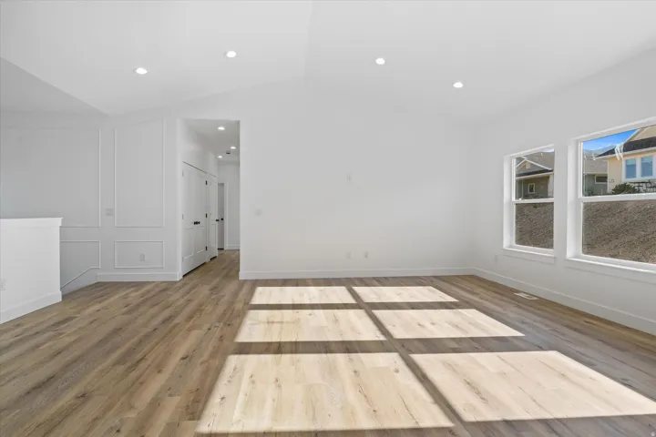Spacious room with high vaulted ceilings and recessed lighting