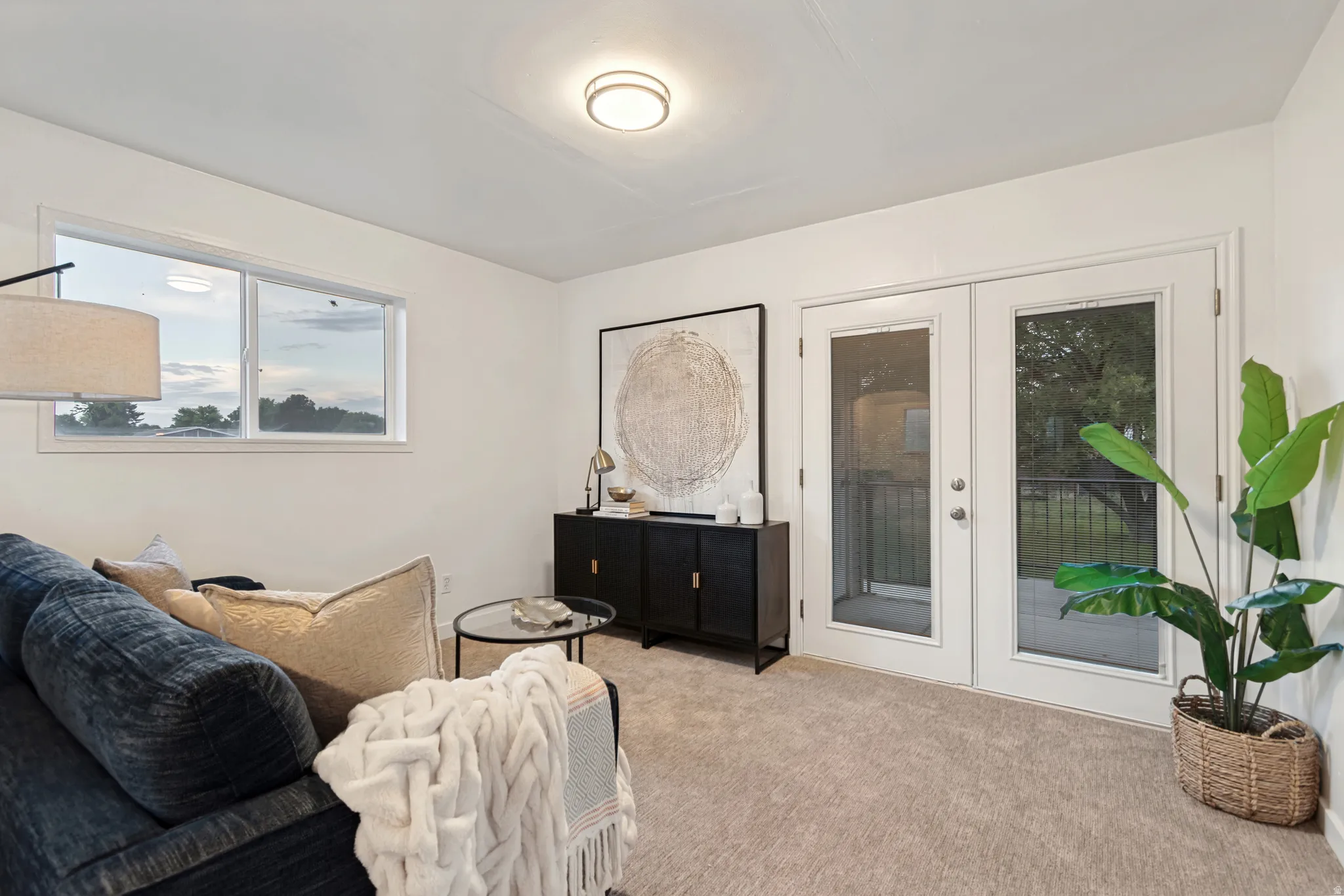 Room featuring light neutral carpeting and white painted walls
