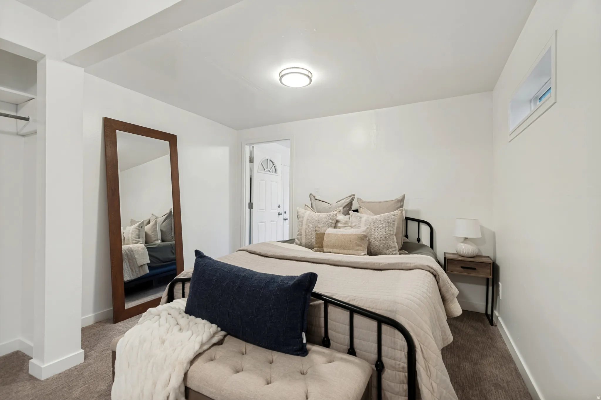 Bedroom featuring white walls and neutral carpet flooring