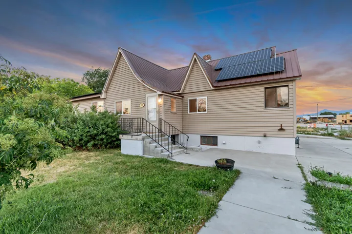 Siding exterior with a metal roof and integrated solar panels