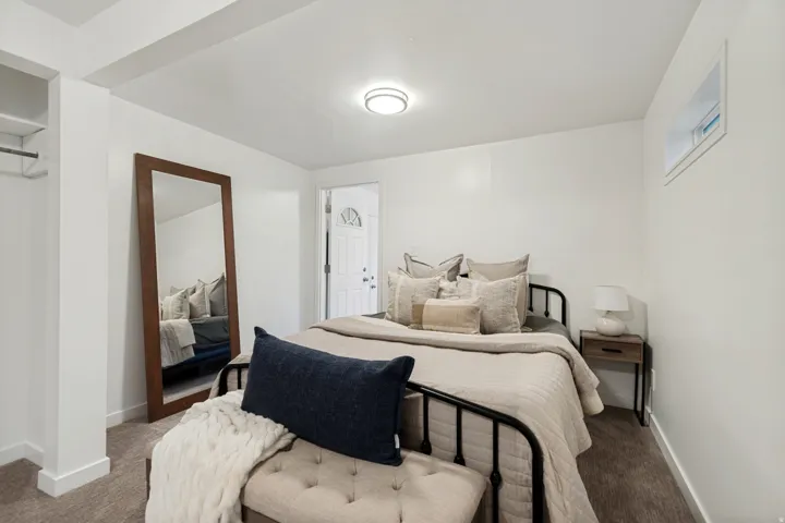 Bedroom featuring white walls and neutral carpet flooring