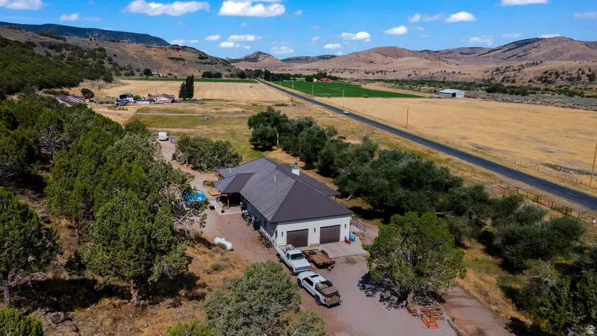 Ranch-style residence featuring a metal roof and an attached two-car garage