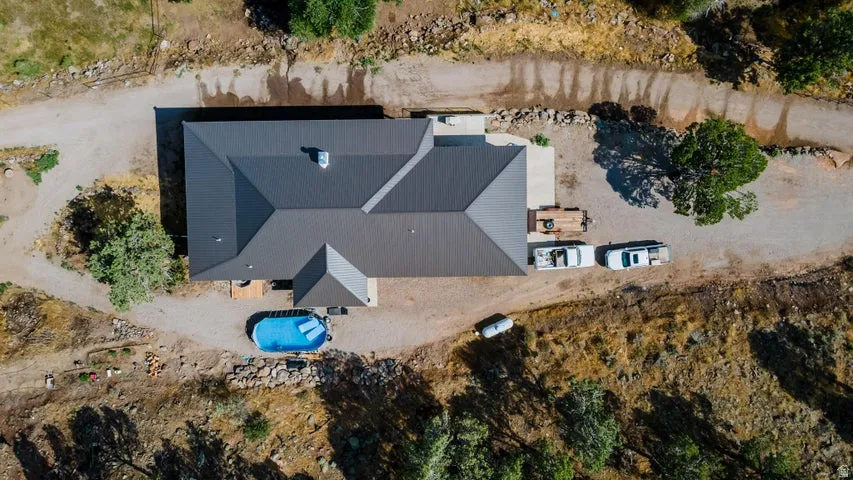 Single-story residence featuring a dark metal roof and an irregular footprint