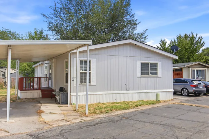 Light gray exterior siding with white trim