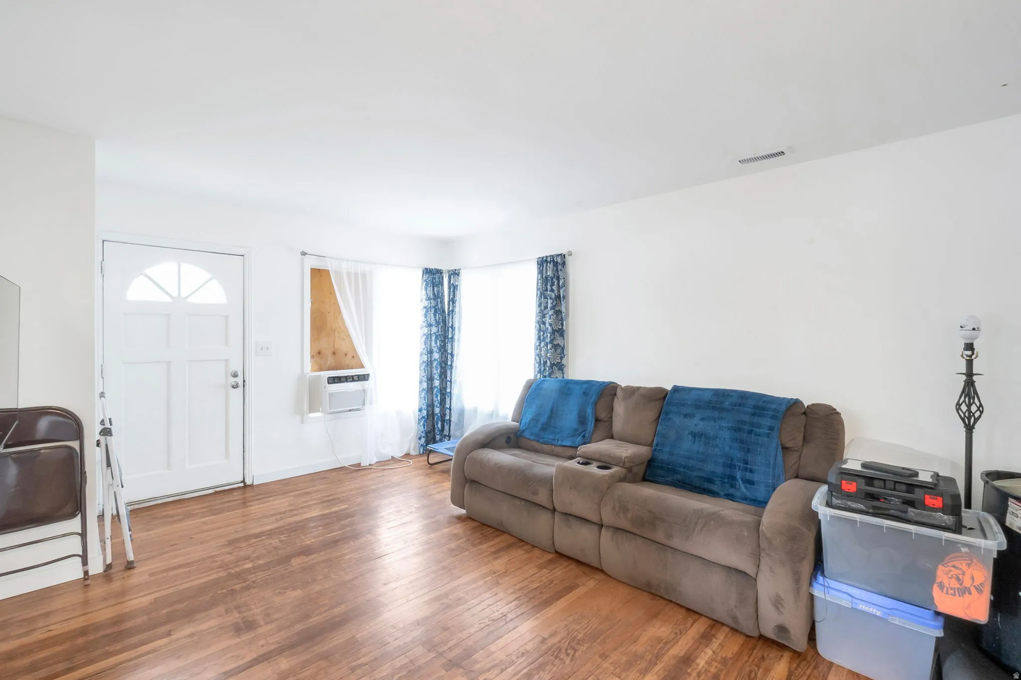 White painted walls and wood-finish flooring