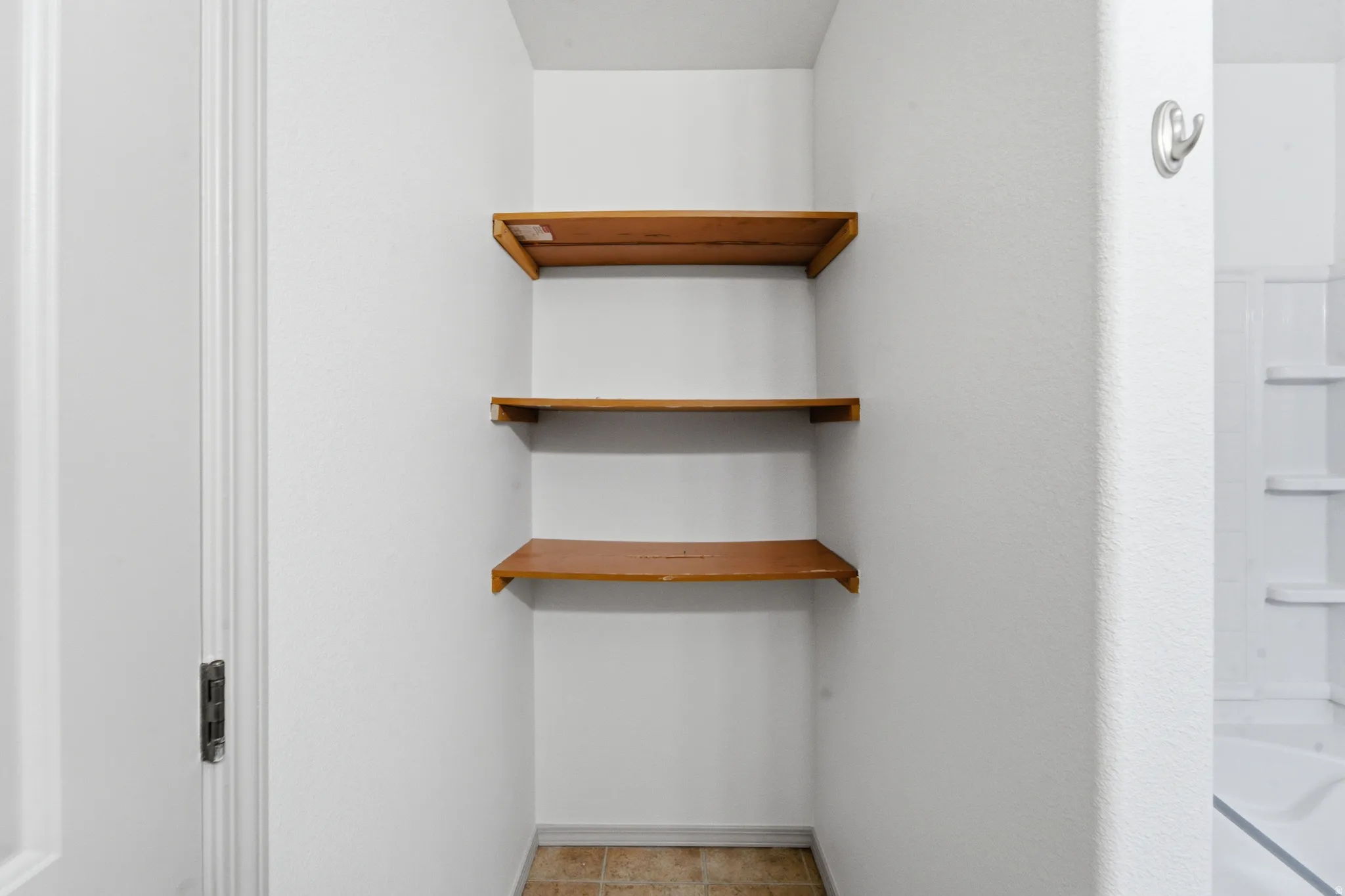 Built-in shelving with three wood shelves
