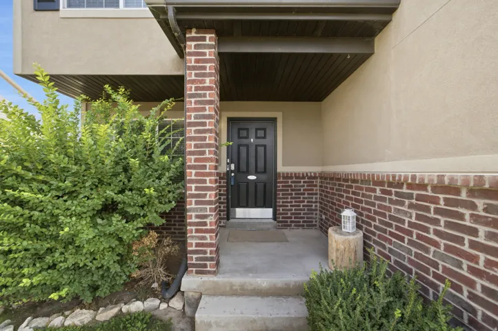 Front entry with concrete steps and landing