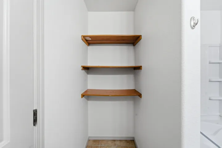 Built-in shelving with three wood shelves