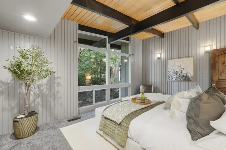 Vaulted wood-paneled ceiling with exposed beams