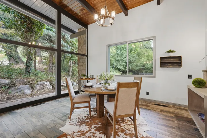 Breakfast nook featuring floor to ceiling windows