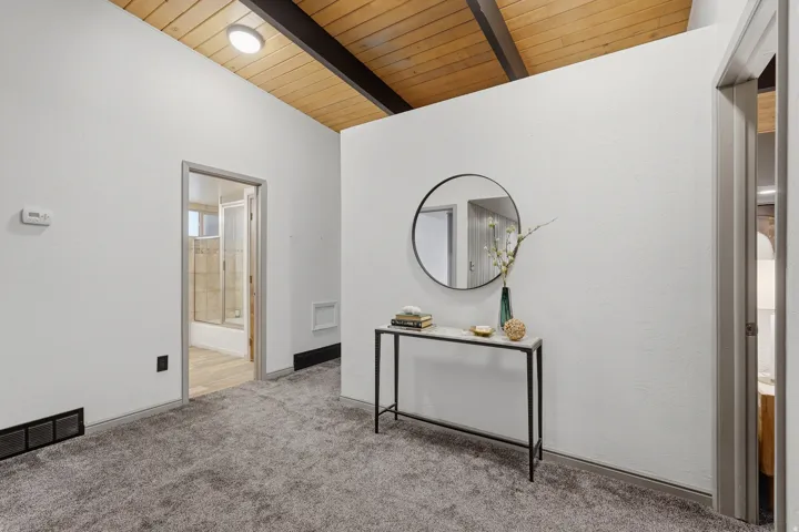 Vaulted wood-finish ceiling with exposed beams