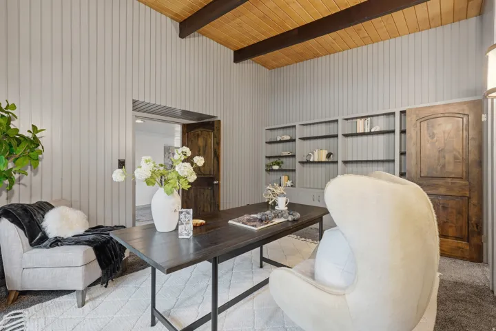 Vaulted wood-paneled ceiling with exposed beams