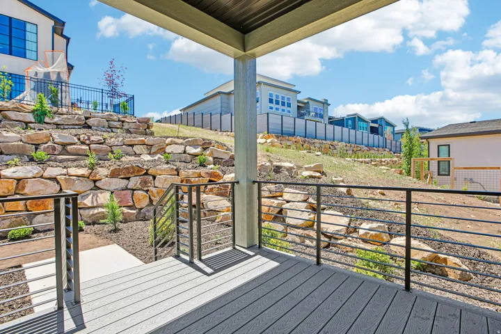 Covered outdoor deck with composite wood-finish flooring