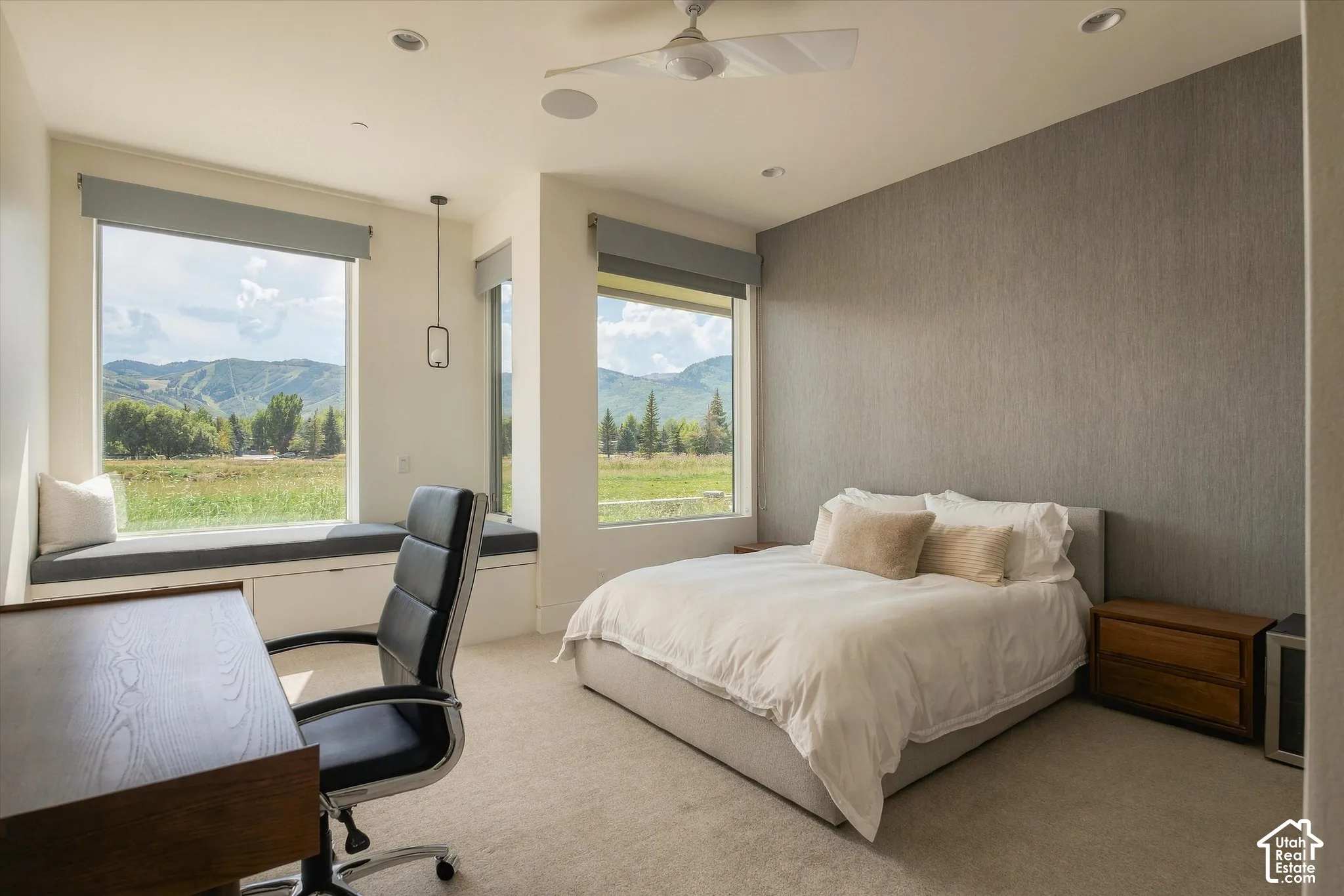Wall-to-wall carpeting with large windows, a built-in window seat, a ceiling fan, and recessed lighting