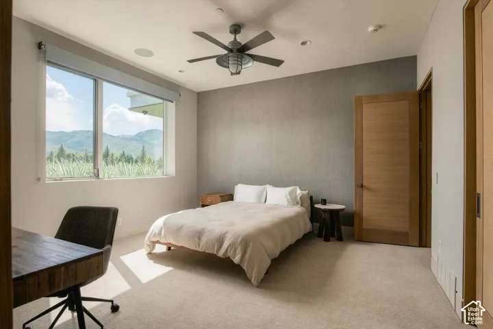 Expansive window with mountain and tree scenery