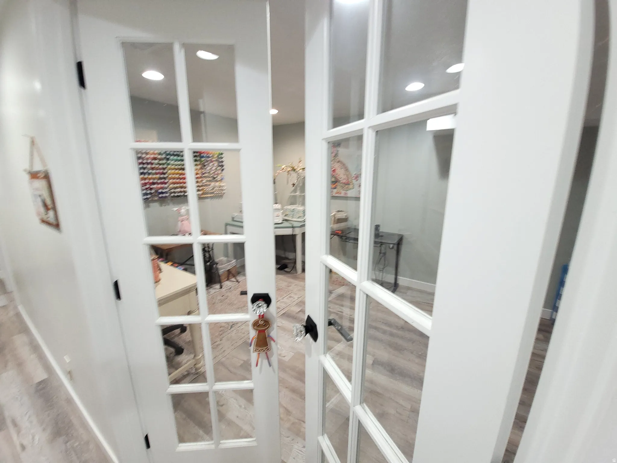 Craft or Office featuring double French doors with multiple glass panes, recessed lighting, and wood-finish flooring
