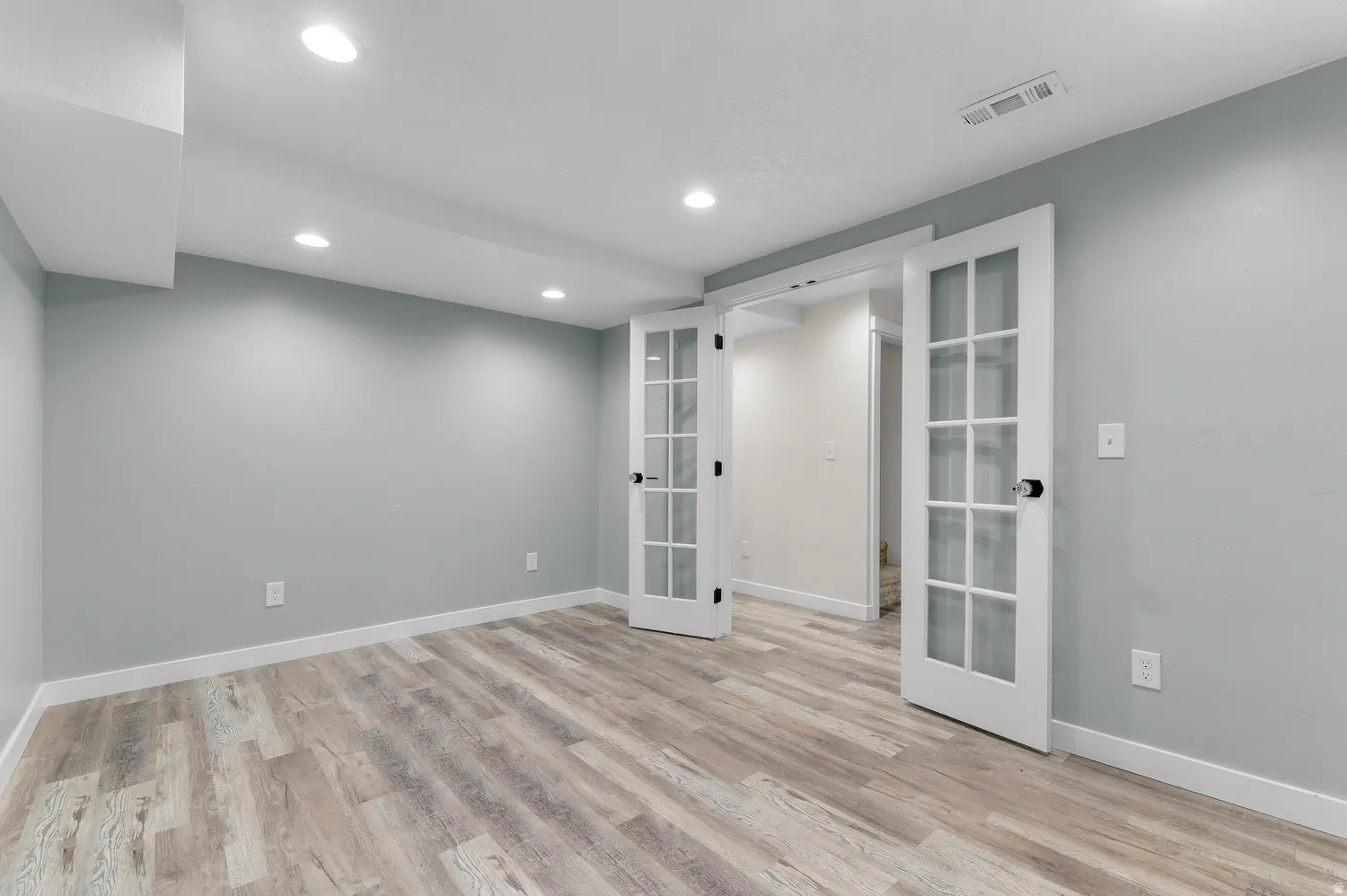 Craft/Office featuring light wood-finish flooring, recessed lighting, and a light-toned wall color