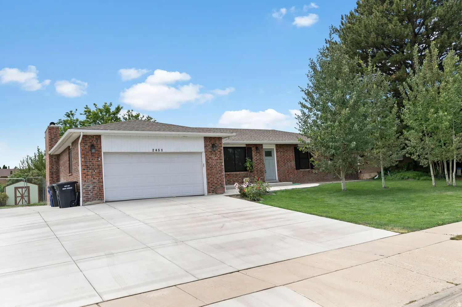 Brick exterior with an attached garage and a ample RV Parking.