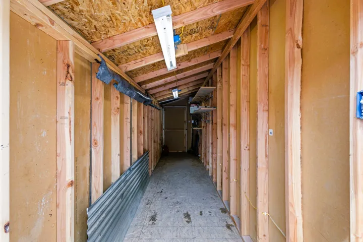 Inside of the oversized custom-built shed attached to the garage for plenty of storage.