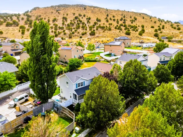 Aerial view of house and mountain views.
