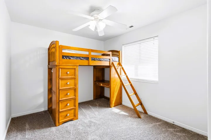 Bedroom #2 featuring new carpet flooring and freshly white painted walls