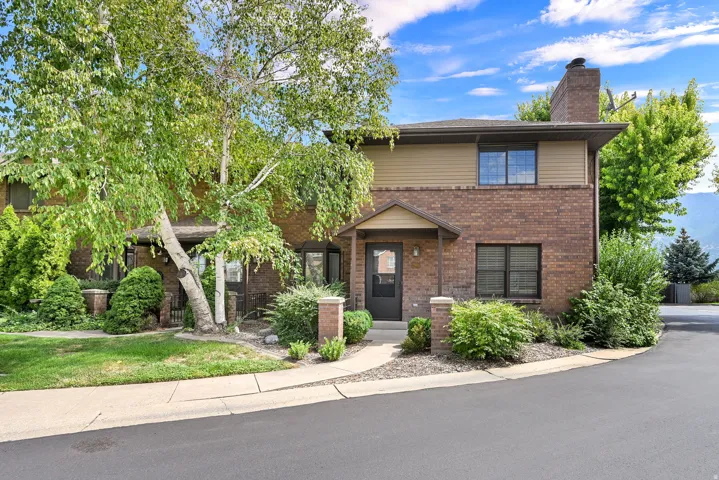 Brick and siding exterior featuring a covered entry