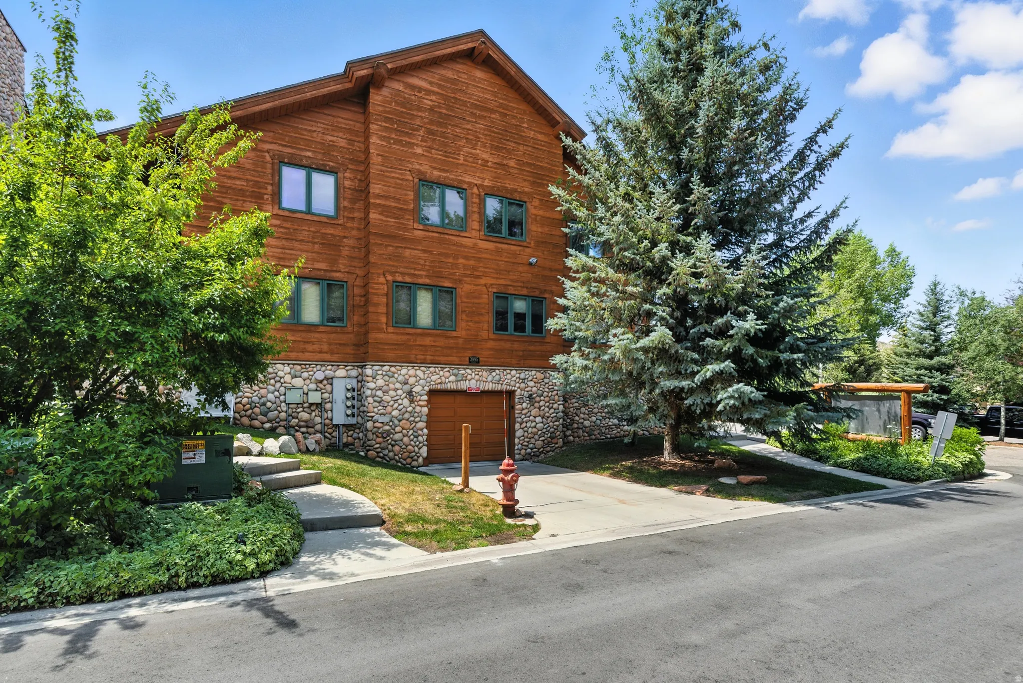 Wood-clad exterior with a natural stone foundation