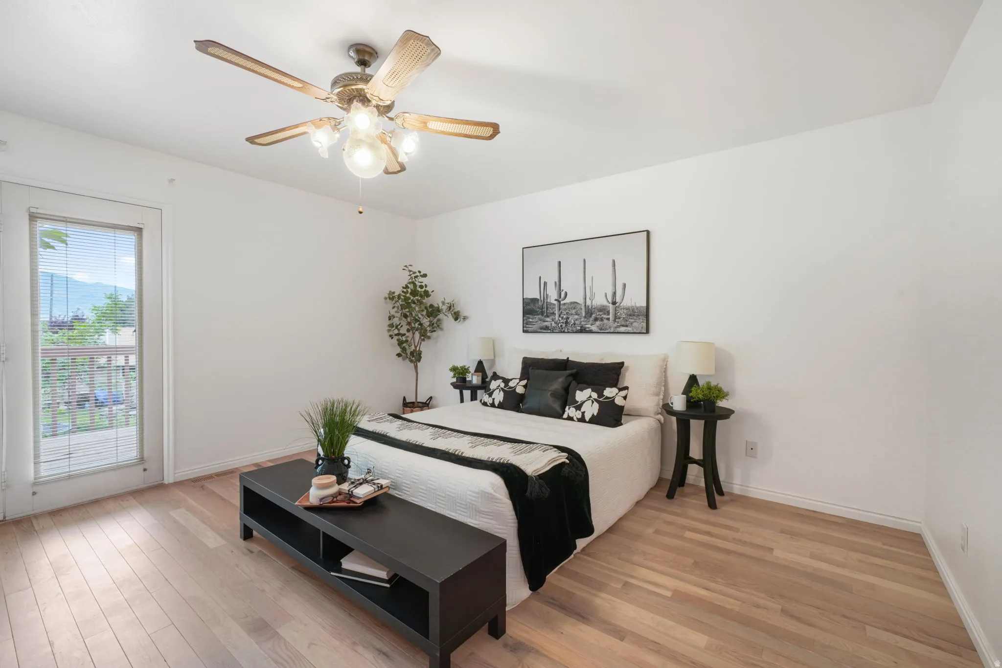 Bright room featuring wood-finish flooring and a light-toned ceiling